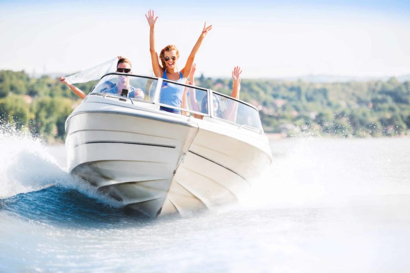 speed boat with happy people inside